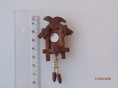 Nukkekoti käkikello, kello