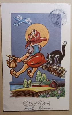 Noita luudalla kissan kanssa ihmettelee lentokonetta p. 1948