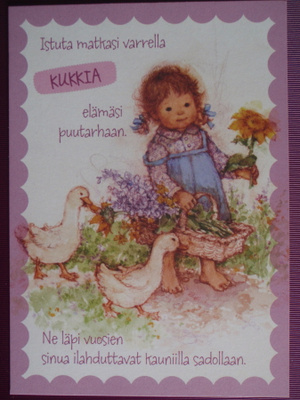 Tyttönen kerännyt kukkasia elämän puutarhaan