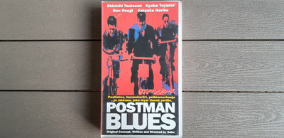 VHS: Postman Blues (O: Sabu 1997)