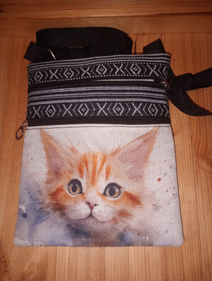 Kissa olkalaukku