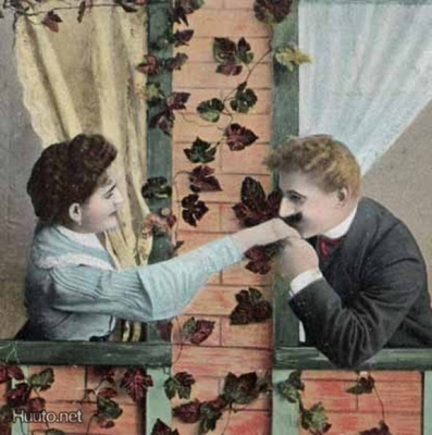 RAKKAUS / Mies suutelee naista kädelle ikkunasta. 1900-l.