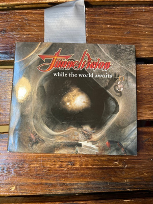 Tunnelvision - While The World Awaits Cd