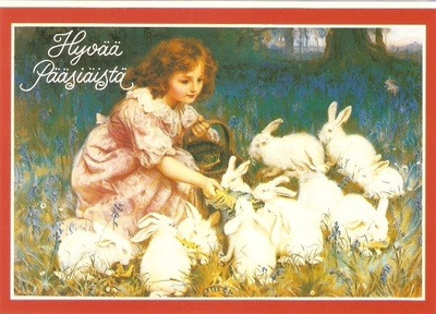 Tyttö syöttää pupuja. Hyvää Pääsiäistä