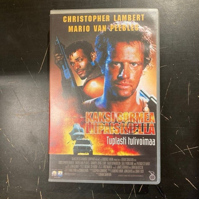 Kaksi sormea liipaisimella VHS