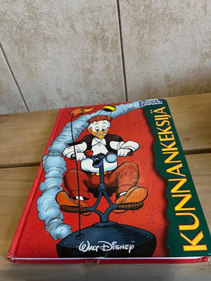 Ankkalinnan kovakantinen sarjakuvakirja Kunnankeksijä