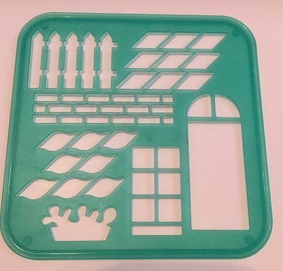 TUPPERWARE Piirrustuslevy : aita, tiiliseinä, ikkuna