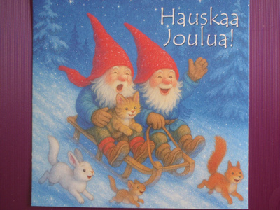 Tontut laskevat kelkalla mäkeä kissan kanssa