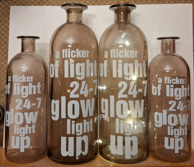 Koristepulloja a flicker of light 24-7 glow light up