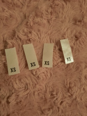 XS kokomerkki