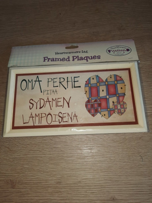 Kyltti : oma perhe pitää sydämen lämpöisenä