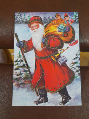 Joulupukki lahjasäkki selässä