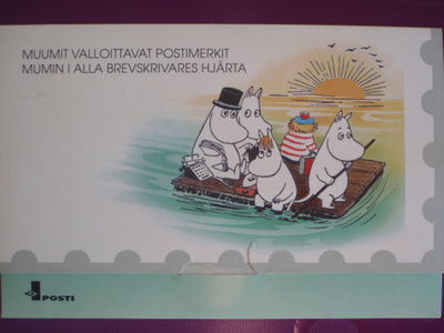 Tove Jansson postikortit ja -merkit kansiossa