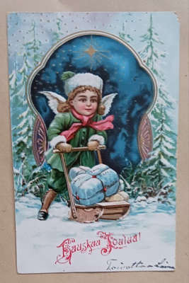Pieni enkeli tuo lahjoja kelkalla, k. k-k
