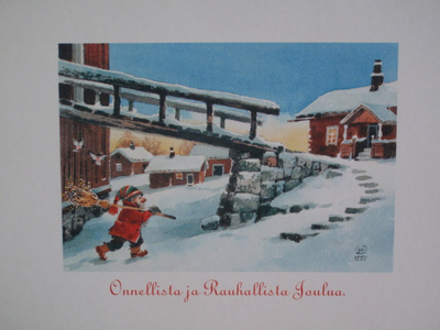 Hannu Taina tonttu laittamassa punatulkuille lyhteen
