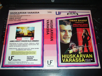 Vhs kansipaperi Fix -  HIUSKARVAN VARASSA  (Sis.pk:t)