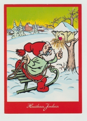 Tonttu istuu reessä lintulaudan luona