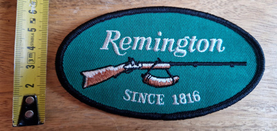 Remington aseet vintage kangasmerkki