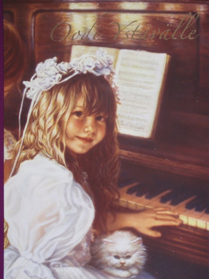 Tyttö soittaa pianoa kissa sylissä
