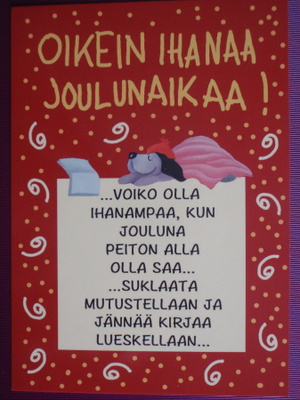 Pertti Ylinen koira nauttii kirjasta ja suklaasta
