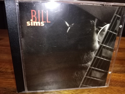 CD Bill Sims ( SIS POSTIKULU)