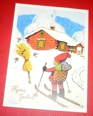 Tonttu tuo lahjoja hiihtäen (K6)