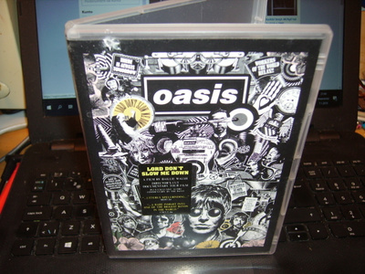 DVD : Oasis : Lord Don't Slow Me Down ( sis. postikulun )