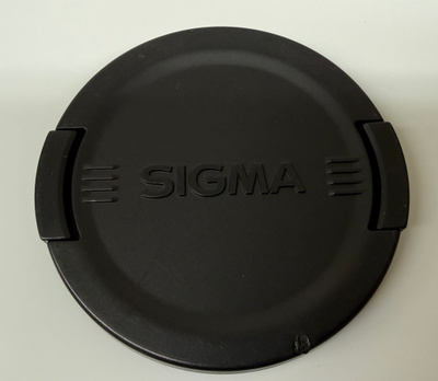 Käytetty Sigma 62mm linssisuojus, musta logo