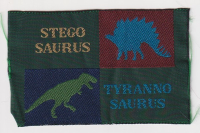Stegosaurus ja tyrannosaurus - kangasmerkki
