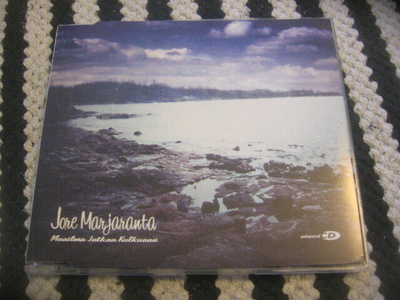 Jore Marjaranta - Maailma jatkaa kulkuaan (cds)