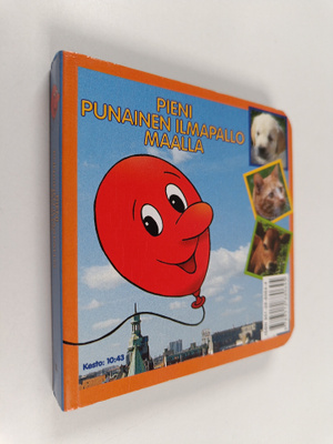 Pieni punainen ilmapallo maalla