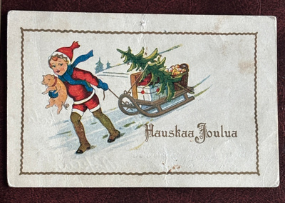 Joulu, Lapsi possu kainalossa vetää kelkkaa, kulkenut