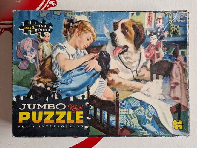 Palapeli vintage. Pieni tyttö ja koira