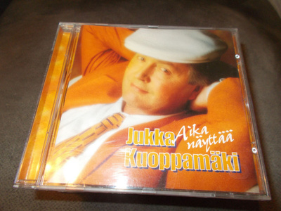 CD JUKKA KUOPPAMÄKI ** AIKA NÄYTTÄÄ **