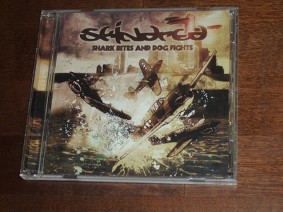 CD Skindres -Shark Bites And Dog Fights