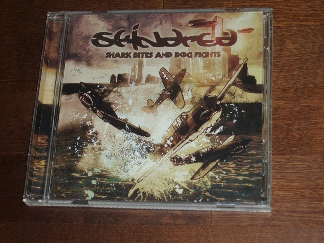 CD Skindres -Shark Bites And Dog Fights