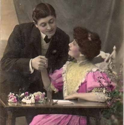 RAKKAUS / Mies pitää tummaa tyttöä kädestä. 1900-l.