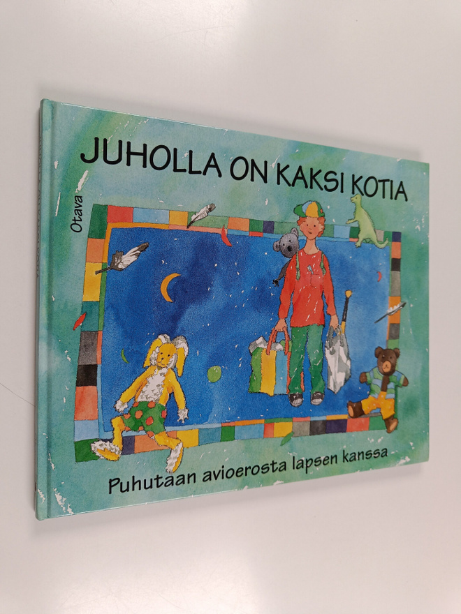 Johanna (toim.) Tarpila : Juholla on kaksi kotia : puhuta...