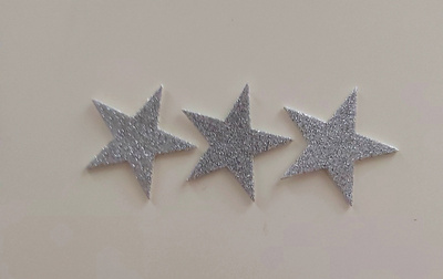 KOHOTARRA Tähdet/hopea..glitteriä n. 5 cm /3 kpl yht.hint.