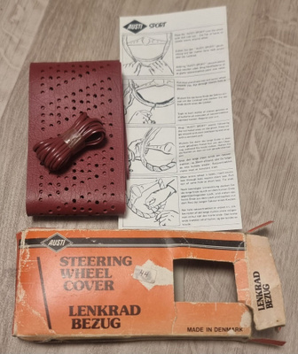 NOS ratin päällinen autoon