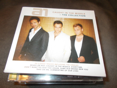 2 - CD A1 ** CAUCHT IN THE MIDDLE THE COLLECTION **