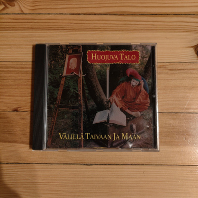 Huojuva Talo - Välillä Taivaan Ja Maan CD
