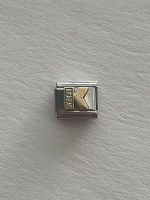 Nomination kivellinen kirjainpala K , Aito
