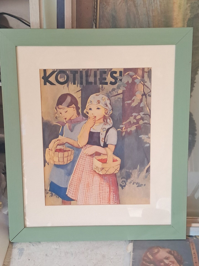 Wendelinin kuvittama juliste kehyksissä.