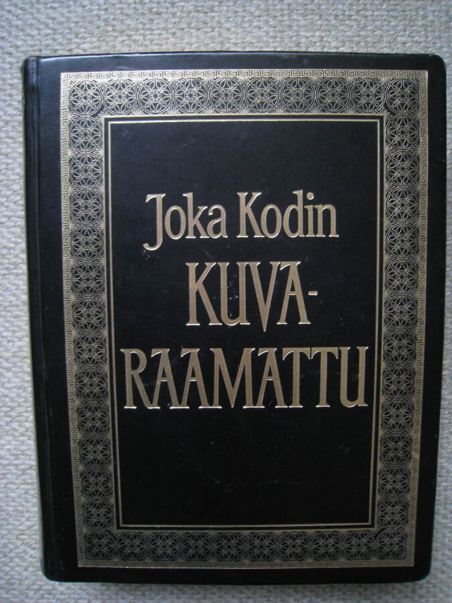 Komea  Joka Kodin Kuvaraamattu