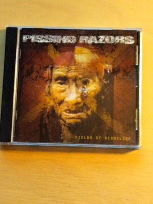 Pissing Razors-Fields of disbelief,cd