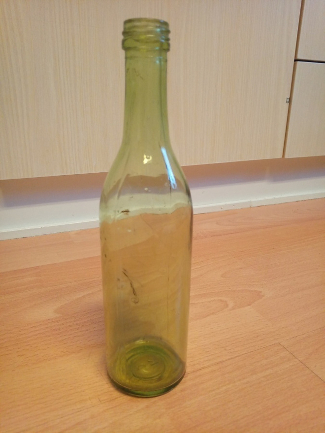 Vihreä lasipullo
