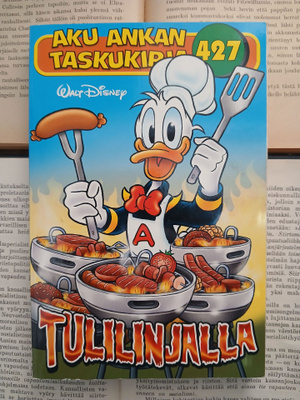 Aku Ankan taskukirja 427 • Tulilinjalla