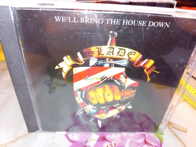 CD Slade : We'll bring the house down ( SIS POSTIKULU  )