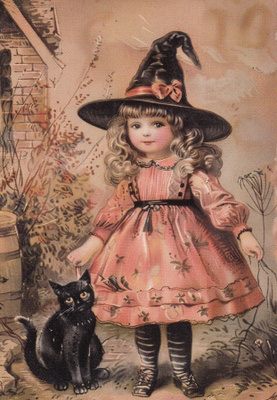 Halloween lapsi vaaleanpunaisessa asussa, musta kissa